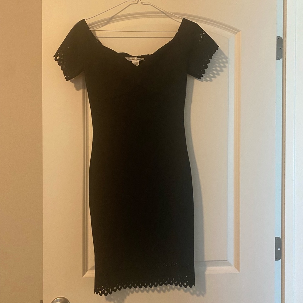 Form fitting dress. Knee length.